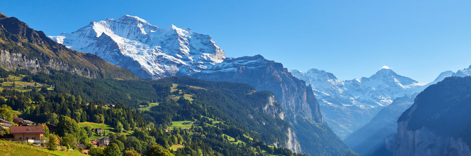 wengen in summer surrounded by high mountain peaks 
