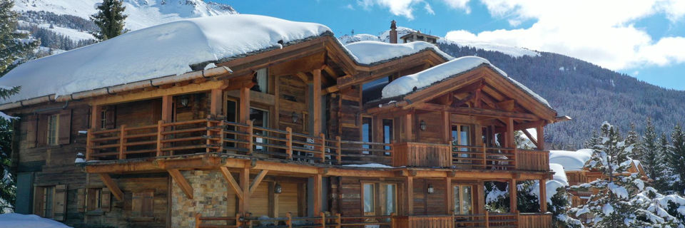 chalet for sale in valais with snowy mountains