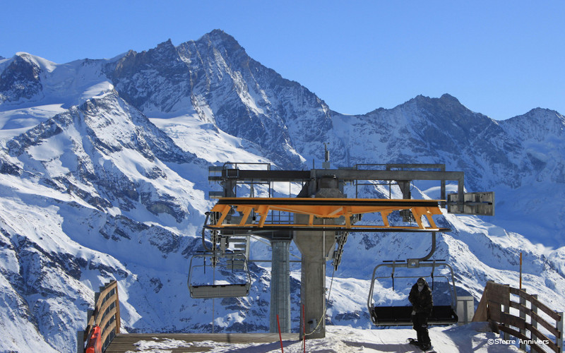 grimentz ski resort, snowboarder coming off lift