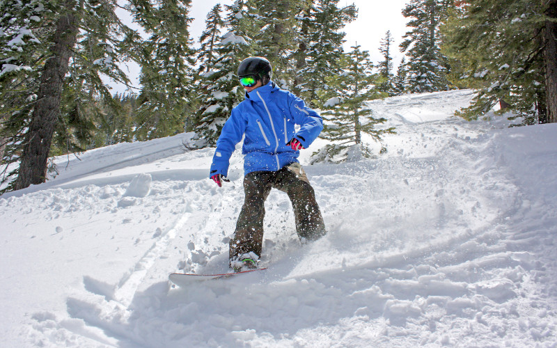 snowboarding through the trees at homewood, lake tahoe ski holidays