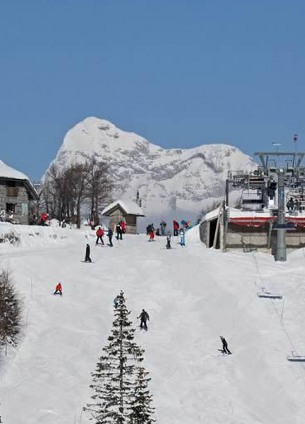 skiing in vogel ski resort, skiers on a piste, slovenia