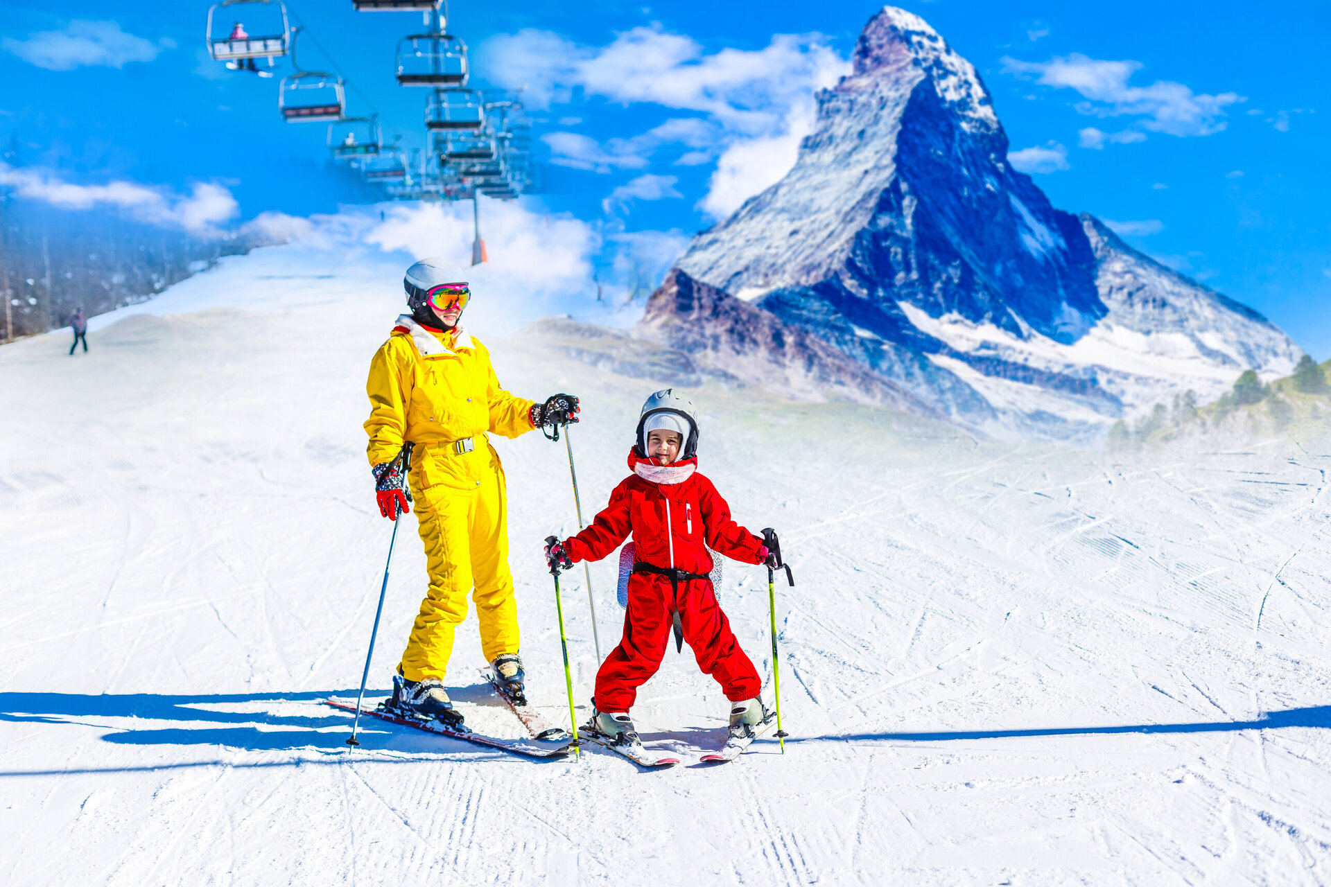 family skiing in zermatt with views of the matterhorn