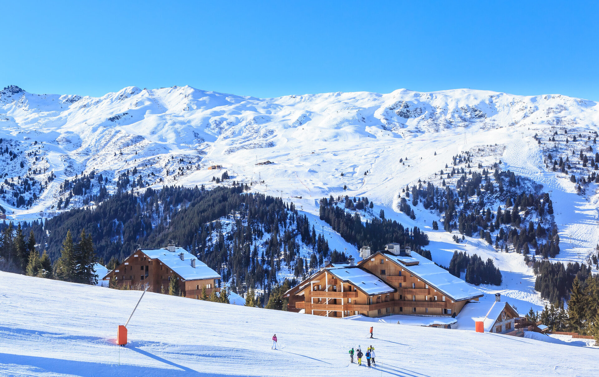 skiers on the slopes in meribel