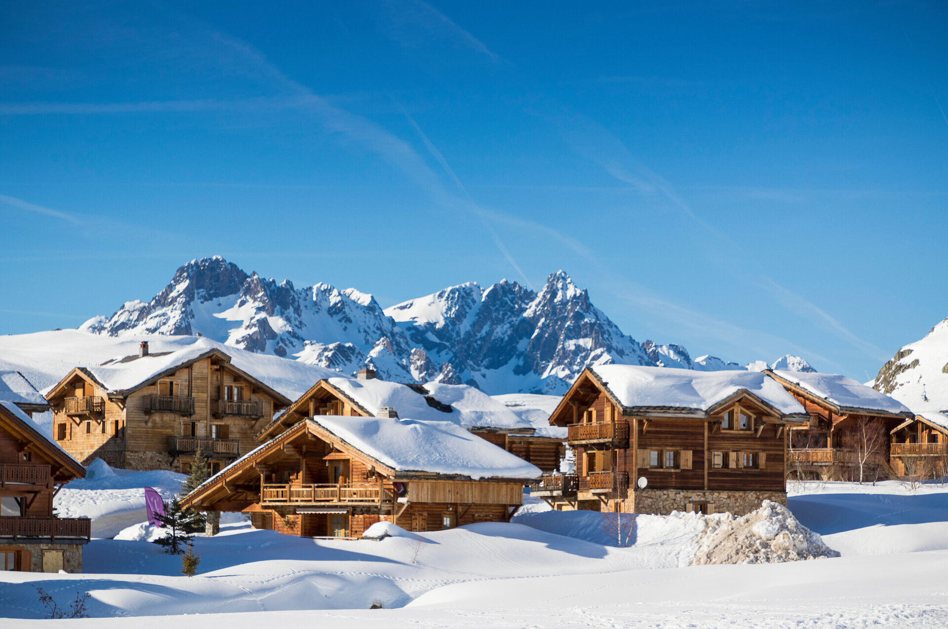 chalets in alpe d'huez covered in snow
