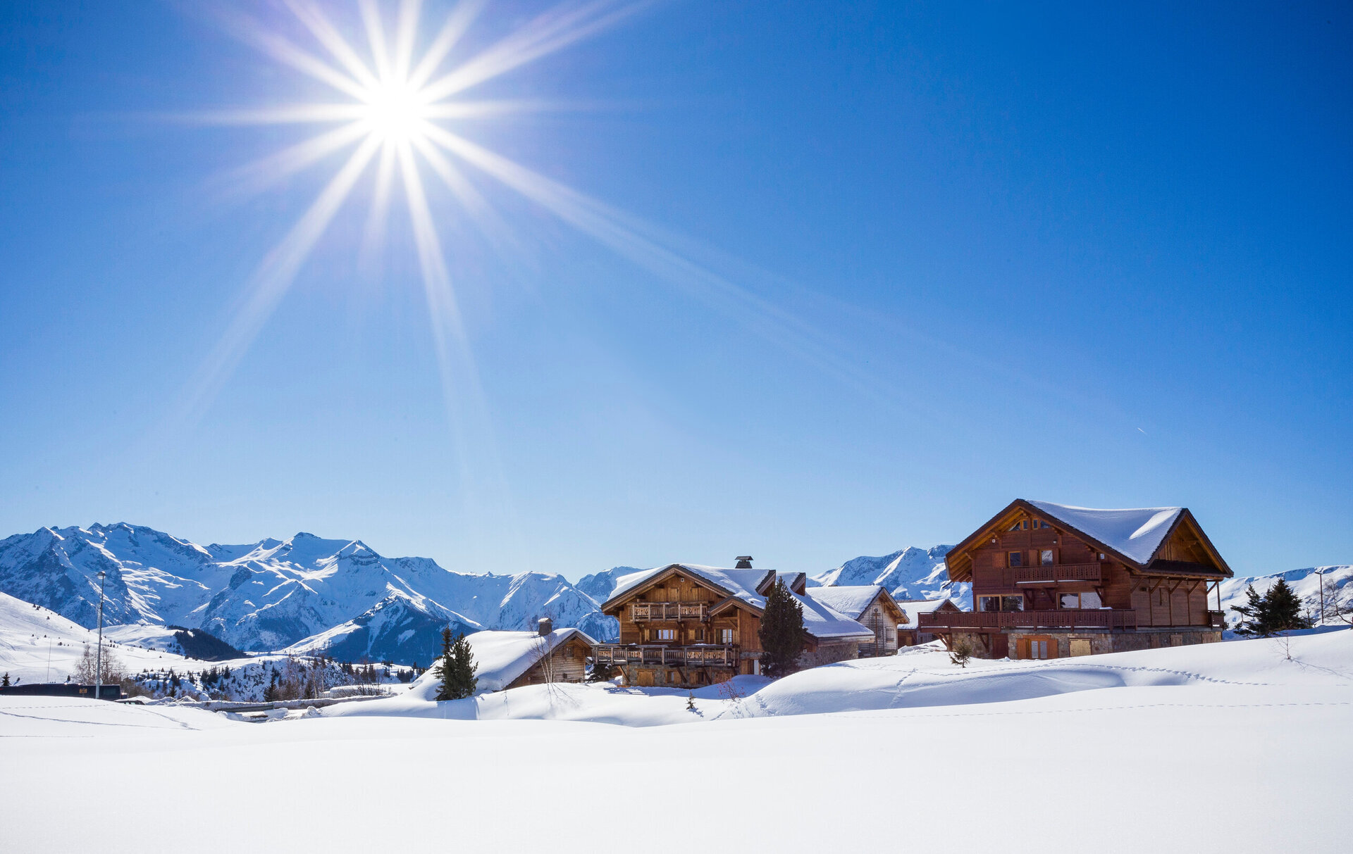 traditional chalets next to the piste in alpe d'huez